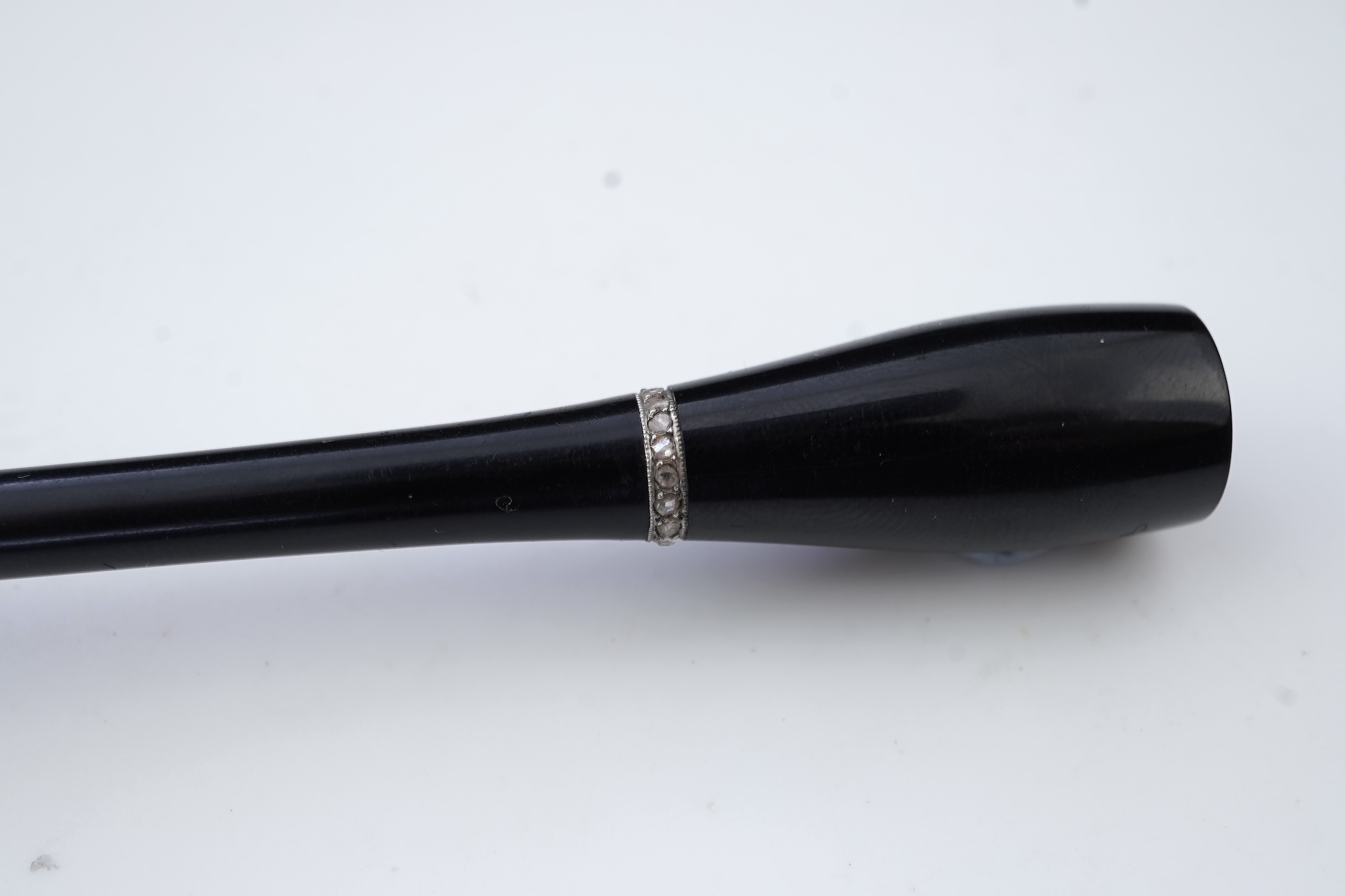 An Art Deco jet and diamond cigarette holder, 1920s
